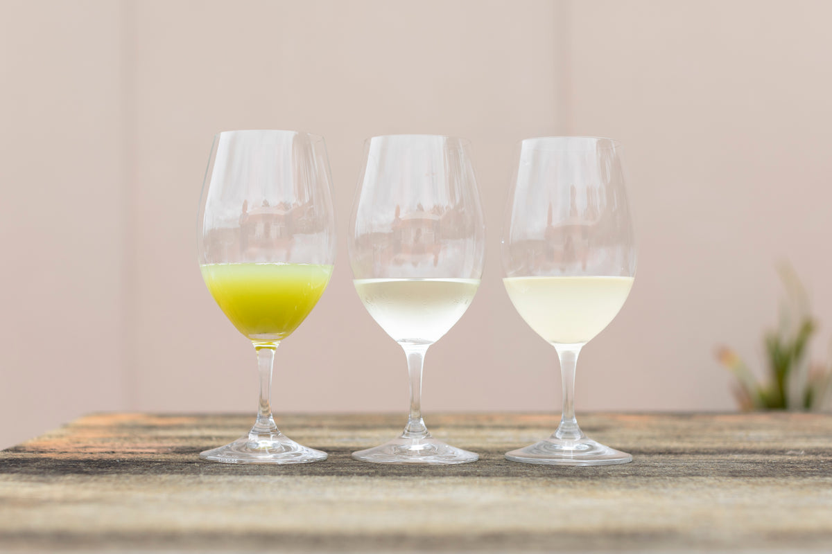 Semillon juice and wine samples displayed in three tasting glasses